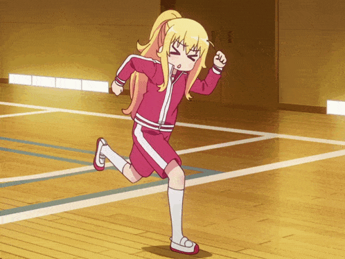 a girl with a ponytail is running on a basketball court