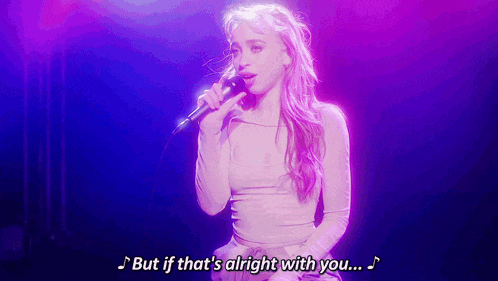 a woman singing into a microphone with the words " but if that 's alright with you "