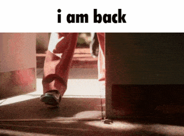 a picture of a person walking with the words " i am back " below them