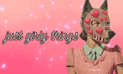 a woman wearing a wolf mask with hearts on her face has the words just girly things written above her