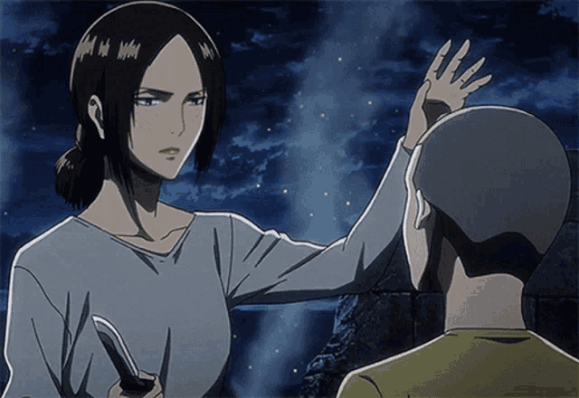 a woman in a blue shirt is holding a knife in front of a man in a yellow shirt