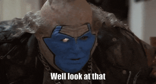 a man with blue paint on his face has the words well look at that below him