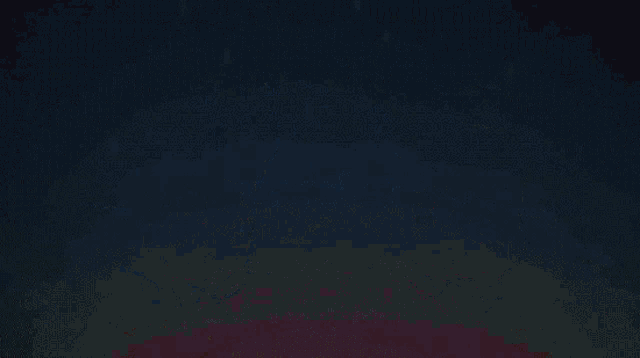 two minions dressed as clowns are dancing together