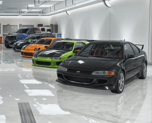 a row of cars in a garage one of which is a black car
