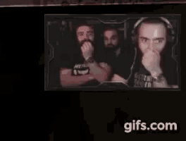 a picture of a man with a beard is displayed on a screen with the website gifs.com at the bottom