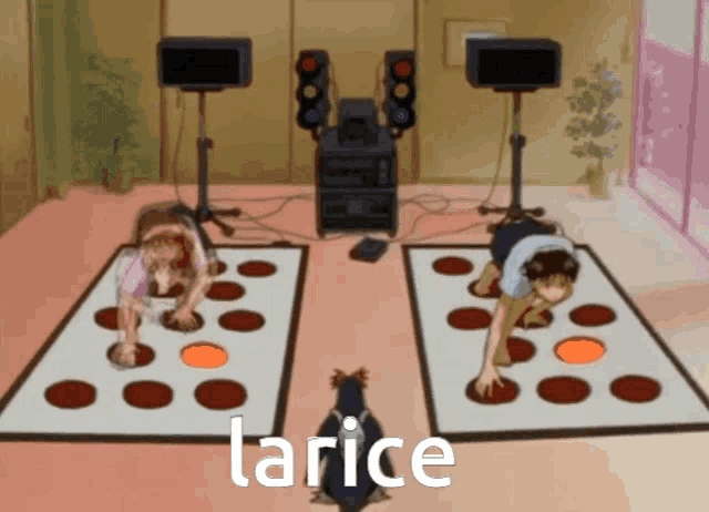 two people are playing a game with the word larice on the floor