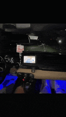 a person driving a car with a sign that says v-porter