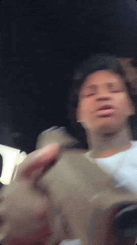 a blurry picture of a person with their eyes closed and their mouth open