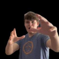 a man in a blue shirt is making a hand gesture with his hands