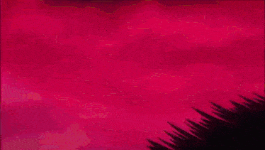 a close up of a pink and black object on a red background