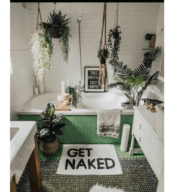a bathroom with a bathtub and a sign that says " get naked "