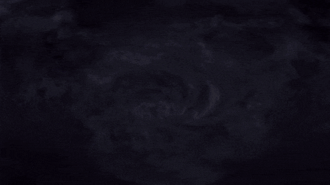 a fire is coming out of a dark hole in the sky .