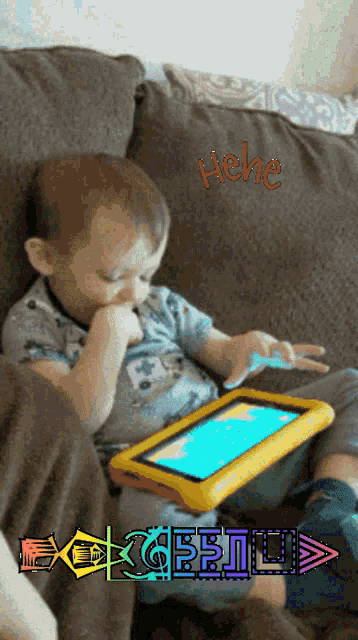 a little boy is sitting on a couch playing with a tablet and the words " hehe " are above him