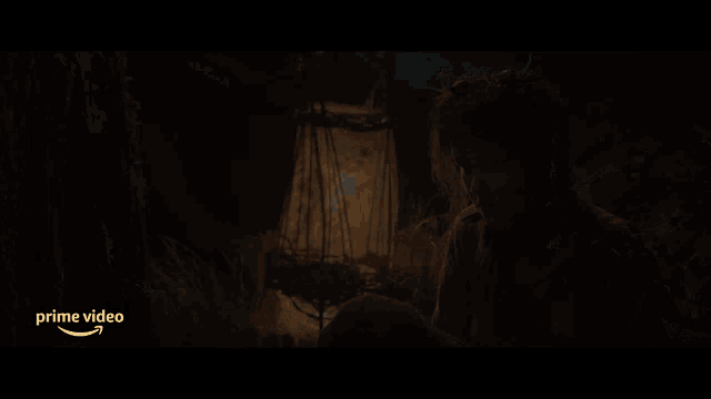 a girl in a dark room with an amazon prime video logo