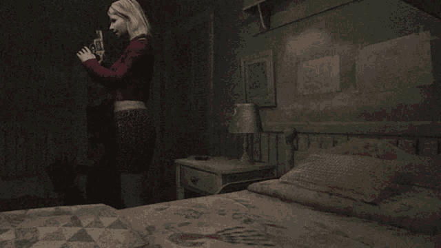a woman in a red dress is standing in a dark bedroom next to a bed