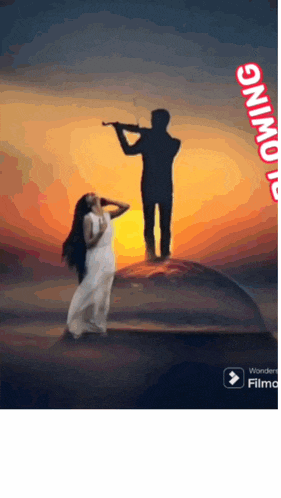 a woman in a white dress stands next to a man playing a violin in a glass dome