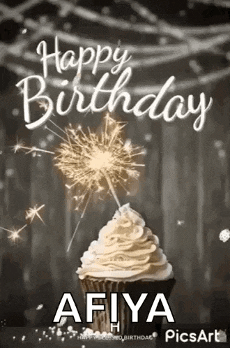 a cupcake with whipped cream and sparklers on top of it .