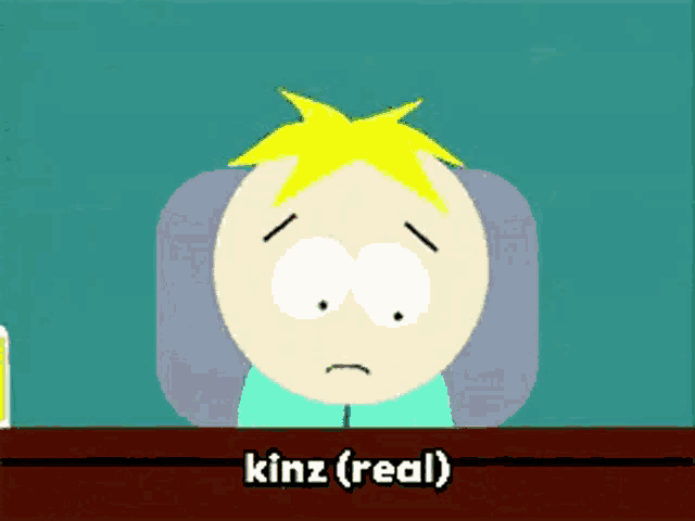 a cartoon character from south park is sitting at a table with the words kinz ( real ) on the bottom .