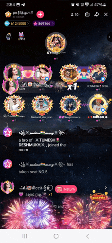a phone screen shows a fireworks display and a group of people on it