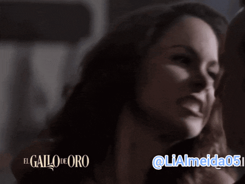 a close up of a woman with the words el gallo de oro in the background