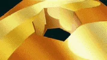 a close up of a yellow object with a black hole in it .