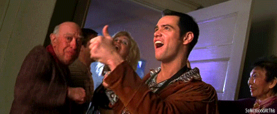 a man giving a thumbs up in front of a group of people