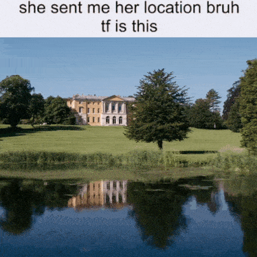 a large house sits in the middle of a lush green field near a lake