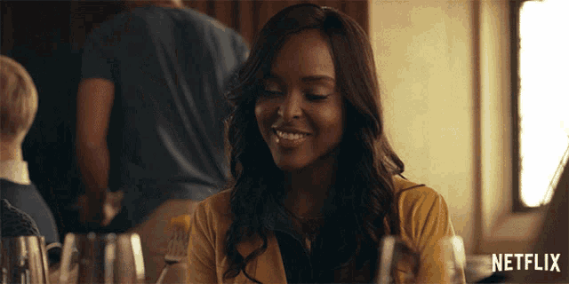 a woman is smiling in a netflix advertisement