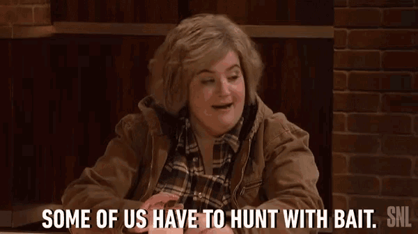 a woman is sitting at a table with the words some of us have to hunt with bait