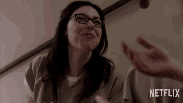 a woman with glasses and a netflix logo on the bottom
