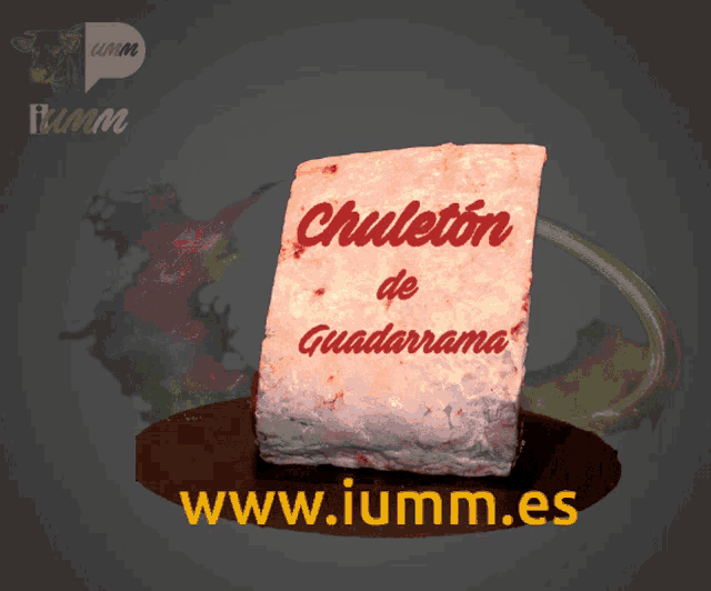 a piece of meat sits on a table with the website www.iumm.es displayed