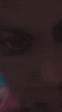 a close up of a person 's face with a purple background