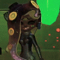 a cartoon character with a long tentacle is standing in front of a green wall .