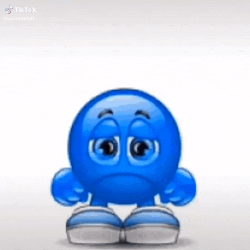 a blue smiley face with a sad face is standing on a white surface .