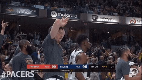 a basketball game is being played in front of a motorola sign