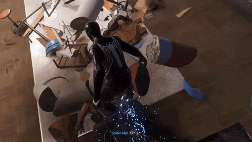 a video game character named spider-man is standing on a table