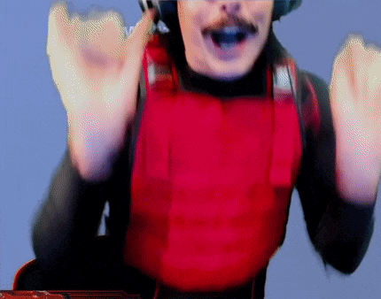 a man wearing a red vest and headphones is making a fist