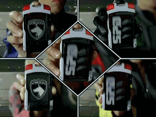 a person is holding a device that says police on the front