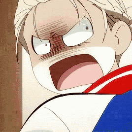 a close up of a person 's face with a surprised look on their face