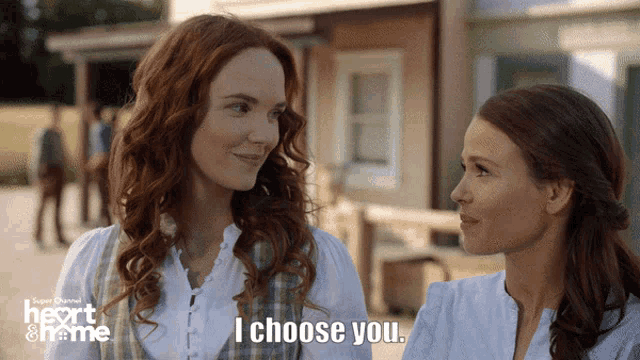 two women standing next to each other with the words i choose you on the bottom right