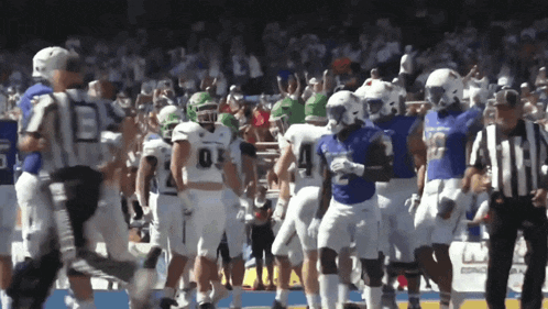 a group of football players with one wearing a jersey with the number 2 on it