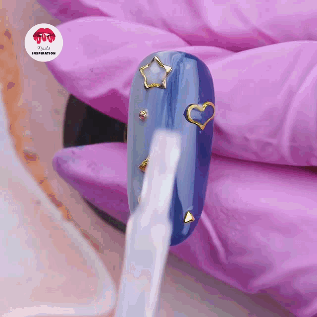 a close up of a nail with a sticker that says nails inspiration on it