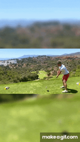 a man is swinging a golf club at a golf ball on a green field