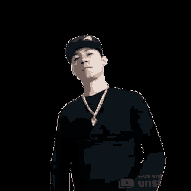 a man wearing a hat and a necklace is making a funny face .