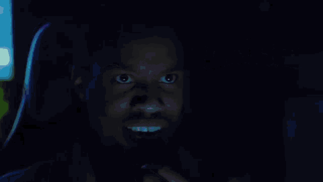 a man in a dark room with the words unlocked 1.5