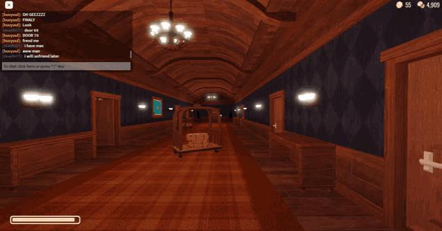 a screenshot of a video game shows a long hallway with a trolley in it