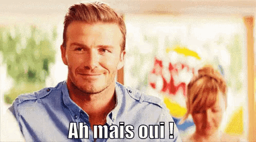 a man is smiling and says ah mais oui !