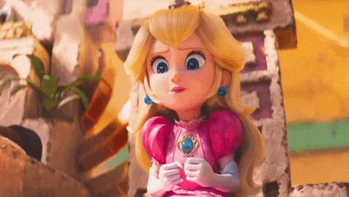 a doll of princess peach is sitting on a rock