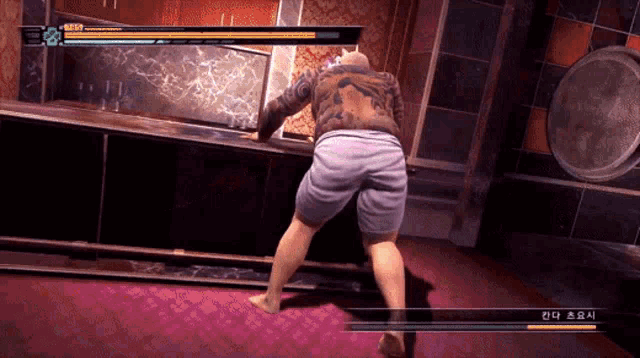 a man is playing a video game with chinese writing on it