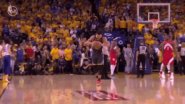 a basketball player is jumping in the air while holding a basketball